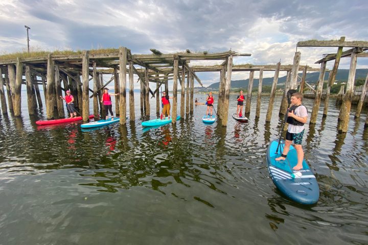 a group of people riding on the back of a boat