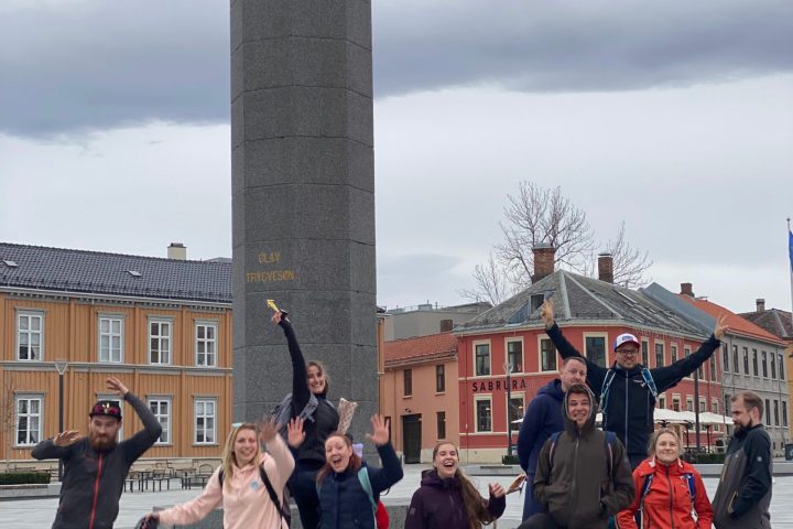 a group of people standing in front of a building